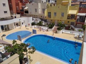 an overhead view of a swimming pool in a building at Maison en duplex & rooftop in Callao Salvaje
