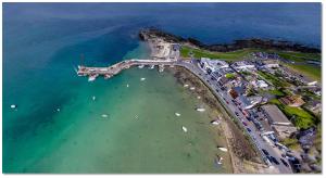 an aerial view of a beach with boats in the water at Lifeboat House in Skerries