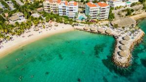 an aerial view of a beach with a resort at Bayside Boutique Hotel - Blue Bay Golf & Beach Resort in Willemstad