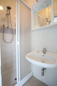 a bathroom with a sink and a shower at Conero Casa Vacanze Amelia Garden in Numana