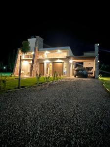 a house with a car parked in front of it at night at De Alma Tinta - Petit Chalet in San Rafael