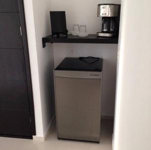 a corner of a kitchen with a counter with a dishwasher at Luxurious Surf Resort in Pascuales Mexico Room 5 in Los Pascuales