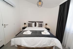 Postel nebo postele na pokoji v ubytování Kapov's Rooms + 10 fotografií