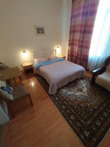 Säng eller sängar i ett rum på Lviv Rest Zelena