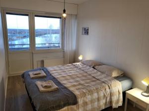 Postel nebo postele na pokoji v ubytování Apartment Lainaankatu