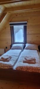Postel nebo postele na pokoji v ubytování Apartmani Prica