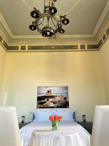 Postel nebo postele na pokoji v ubytování Armonia B&B