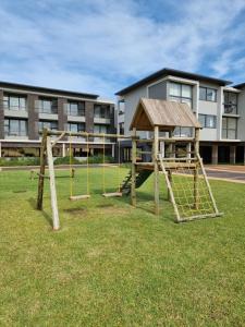 a playground in front of a building at Zimbali Lakes Boulevard Suites in Ballito
