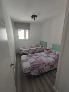 Un pat sau paturi într-o cameră la L'Olivar