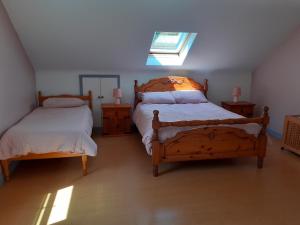Postel nebo postele na pokoji v ubytování Foreen Lodge, Achill Island