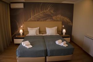 Postel nebo postele na pokoji v ubytování Hotel Rural Rocha da Gralheira + 37 fotografií