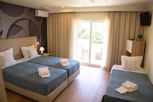 Postel nebo postele na pokoji v ubytování Hotel Rural Rocha da Gralheira