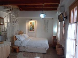 Postel nebo postele na pokoji v ubytování Harmonic Place Loutraki