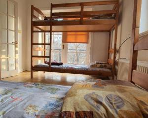 a bedroom with two bunk beds and a window at Хотел на Печерской in Kyiv