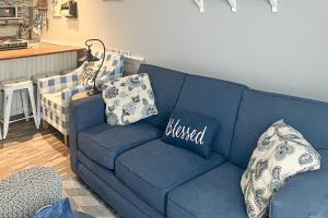 a blue couch with pillows on it in a living room at Misty Harbor 118 in Gilford