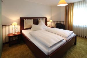 En eller flere senger på et rom på Hotel Kaiserhof