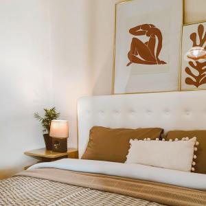 a bedroom with a bed with a white headboard at Villa Despina 2 Plakias Private Villa, Private Swimming Pool Garden, Panoramic Sunset in Asómatoi +28 photos