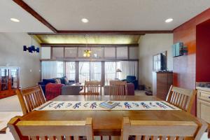 a kitchen and dining room with a table and chairs at Tamarron Lodge Escape in Durango