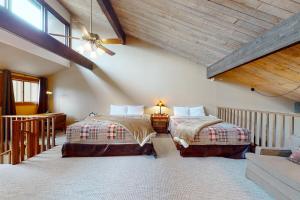 a bedroom with two beds in a attic at Tamarron Lodge Escape in Durango