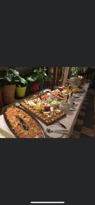 a long table filled with many different types of food at Glessener Braustube in Bergheim