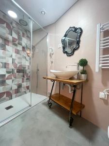 a bathroom with a sink and a shower at Baia do Mundo in Setúbal