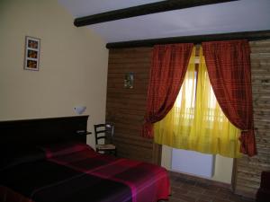 Postel nebo postele na pokoji v ubytování Les Chalets B&B
