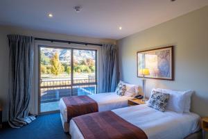 Postel nebo postele na pokoji v ubytování Oakridge Resort Lake Wanaka + 37 fotografií