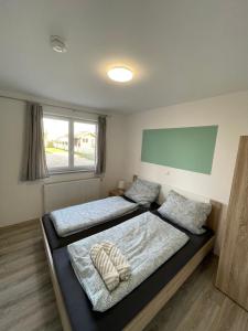 Postel nebo postele na pokoji v ubytování Ferienwohnung Einstein