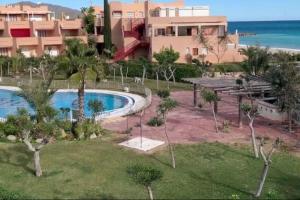 an image of a resort with a swimming pool at Estudio en Urbanización naturista con piscina junto al mar in Vera