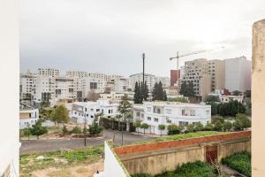 a view of a city with white buildings at Hamriya villa in Meknès