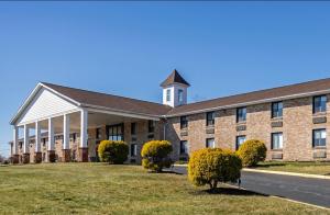 a large brick building with a clock tower on top at Quality Inn Riverview Enola-Harrisburg in Harrisburg