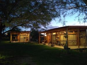 a log cabin with a porch in a yard at La Comarca Loft in San Javier