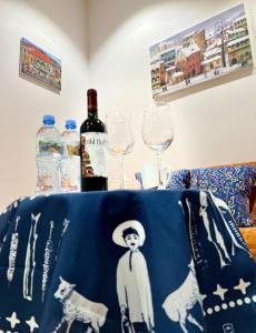 a table with two wine glasses and a table cloth at Room 42 in Tbilisi City