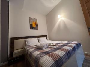 Ένα ή περισσότερα κρεβάτια σε δωμάτιο στο Sololaki 42