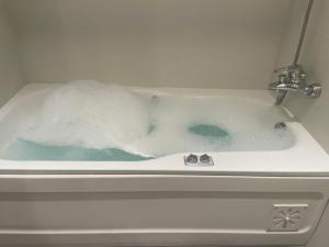 a bath tub filled with lots of snow at ASF Brasil in Lisbon +19 photos