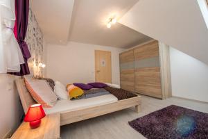 a bedroom with a bed with a wooden frame at Budapest Center Executive Apartments in Budapest