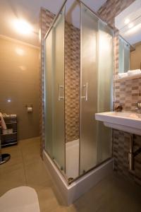 a bathroom with a shower and a sink at Budapest Center Executive Apartments in Budapest