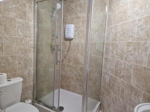 a shower with a glass door in a bathroom at Lovely 1 bedroom apartment in Bristol