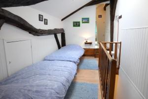 Postel nebo postele na pokoji v ubytování Gîte la Passerelle à Mouzaive
