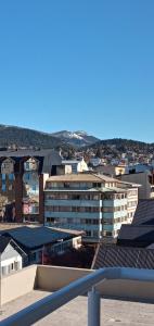 a view of a city with buildings at Reina Mora Apart Bariloche in San Carlos de Bariloche