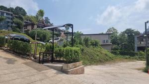 a park with a gate on the side of a hill at AO503 - Penthouse Amazing View 2bedrooms 3Beds 300m Walk To Ao Nang Beeach in Ao Nang Beach