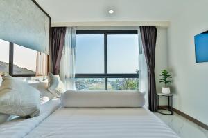 a bedroom with a large bed with a large window at AO503 - Penthouse Amazing View 2bedrooms 3Beds 300m Walk To Ao Nang Beeach in Ao Nang Beach +245 photos