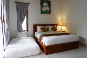 Postel nebo postele na pokoji v ubytování Arya Resort Nusa Penida