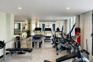 a gym with a bunch of exercise bikes in it at Kampot Sunny Hotel in Kampot