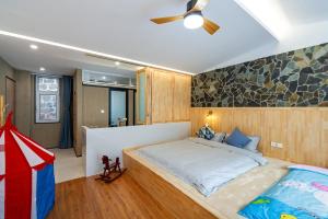 a bedroom with a large bed in a room at Starstay Wuling Mountain B&B in Xinglong