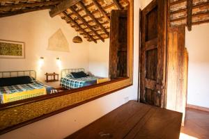a mirror in a room with two beds in it at Cabaña Diego de Lucas 