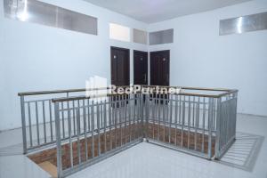 Postel nebo postele na pokoji v ubytování Homestay C9 Exclusive Kaliurang Yogyakarta Mitra RedDoorz
