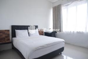 Postel nebo postele na pokoji v ubytování Homestay C9 Exclusive Kaliurang Yogyakarta Mitra RedDoorz