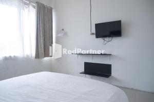 TV a/nebo společenská místnost v ubytování Homestay C9 Exclusive Kaliurang Yogyakarta Mitra RedDoorz