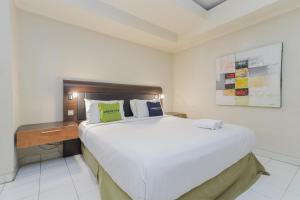 Postel nebo postele na pokoji v ubytování Urbanview Hotel Taman Suci Denpasar Bali